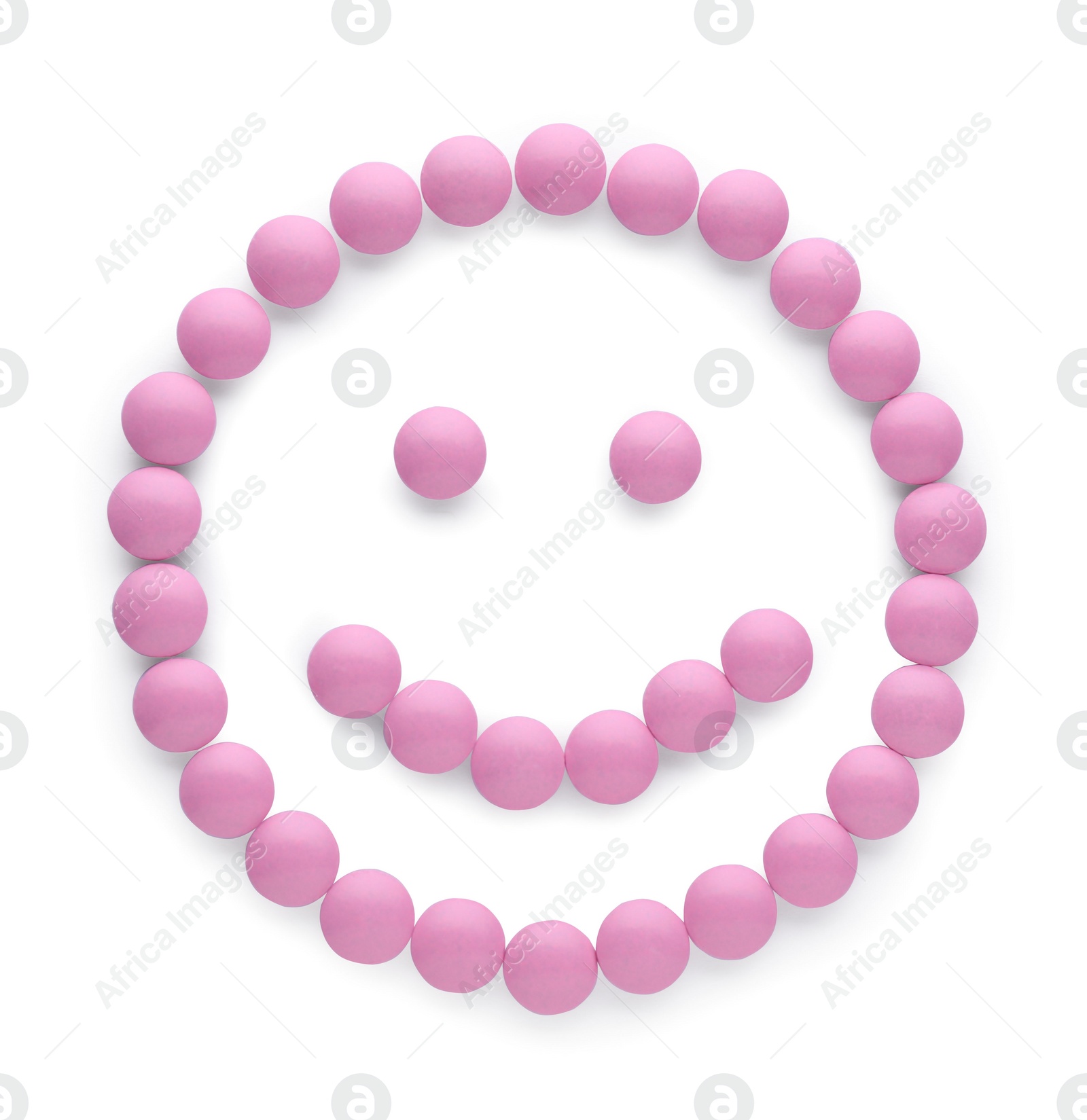 Photo of Happy face made of pink antidepressant pills isolated on white, top view