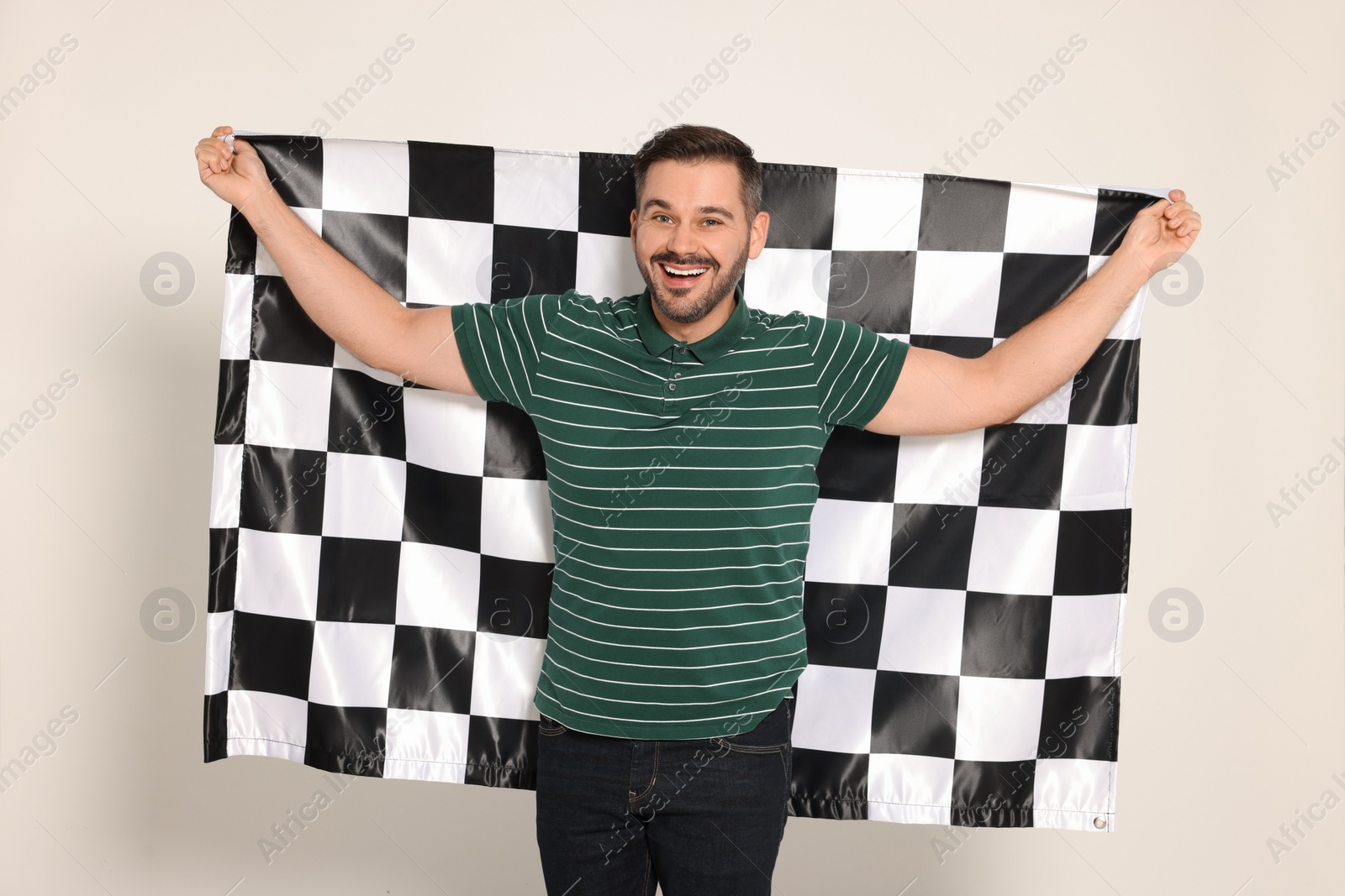 Photo of Man with checkered flag on white background