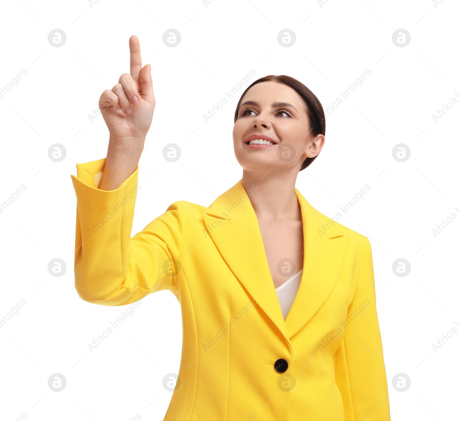 Photo of Beautiful businesswoman in yellow suit pointing at something on white background