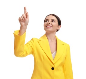 Photo of Beautiful businesswoman in yellow suit pointing at something on white background