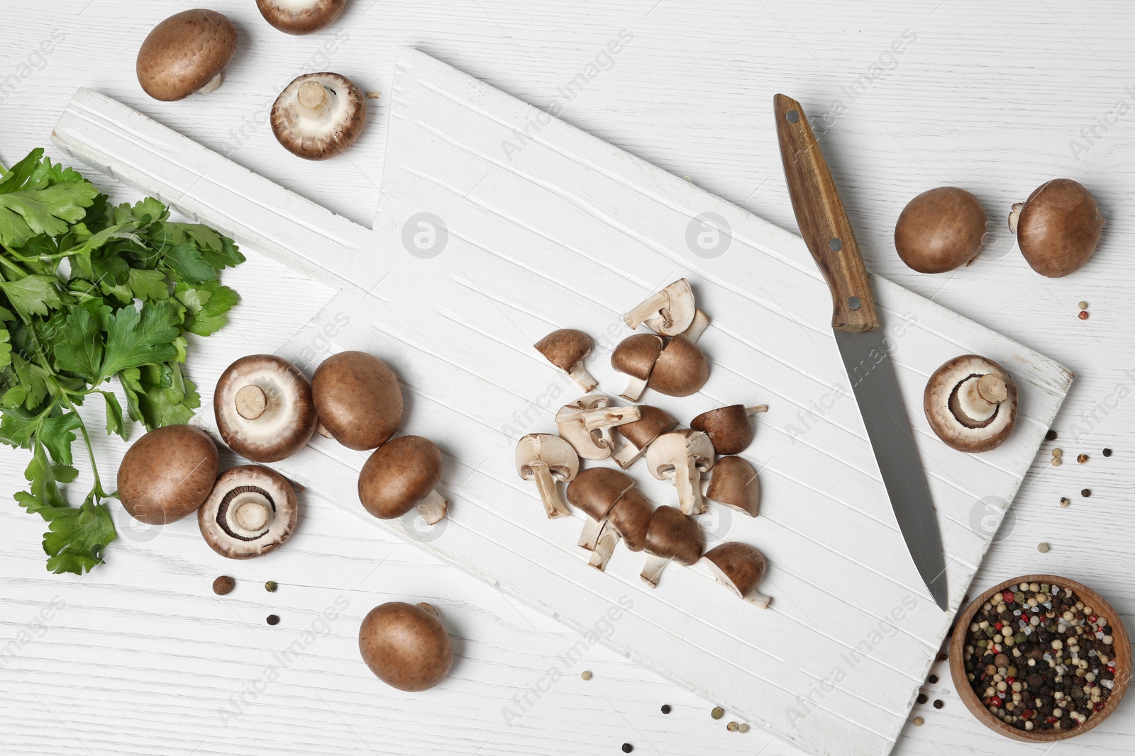 Photo of Flat lay composition with fresh champignon mushrooms on wooden table