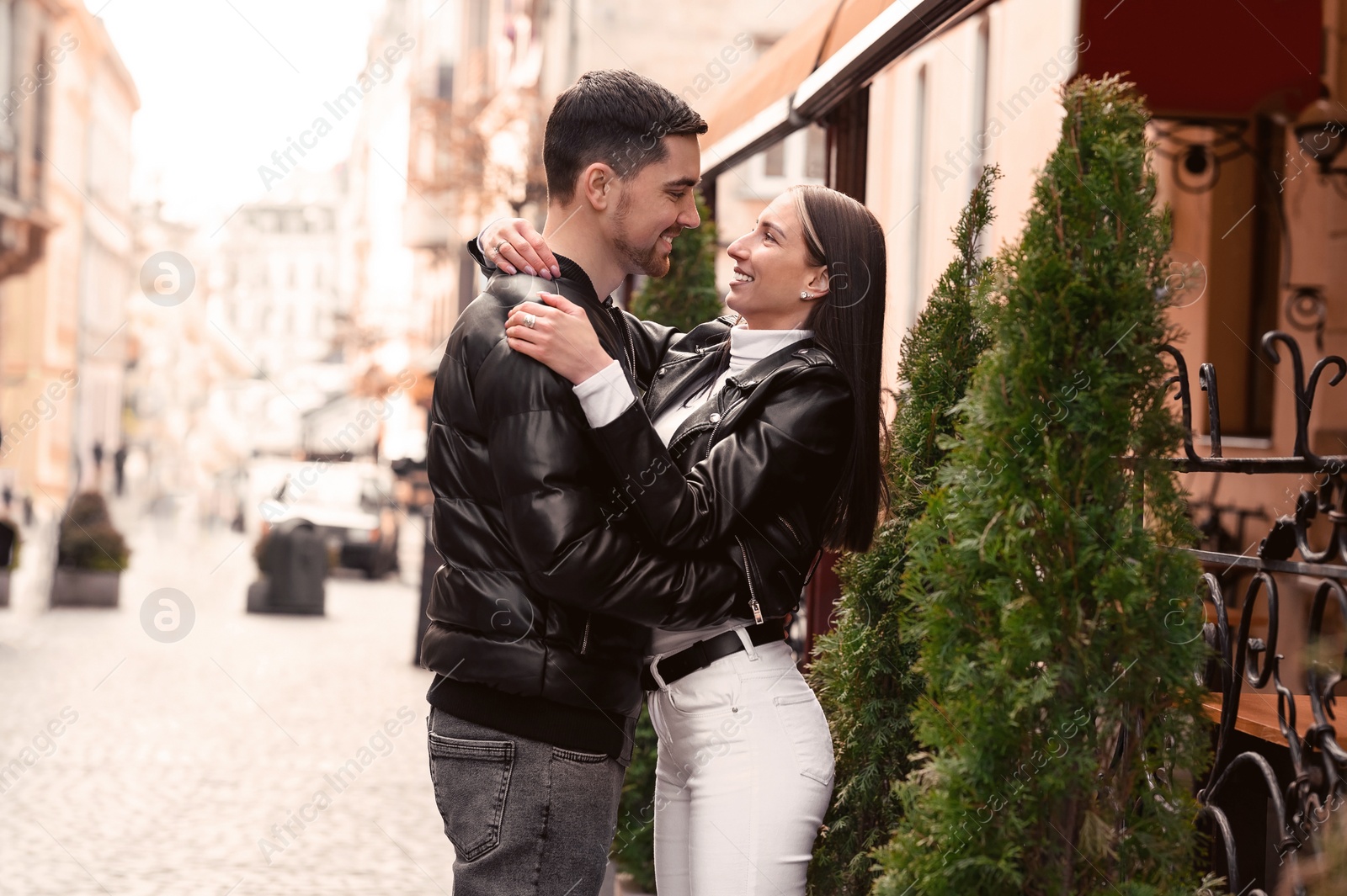 Photo of Lovely young couple enjoying time together outdoors. Romantic date