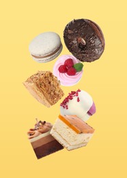 Image of Many different tasty desserts falling on yellow background