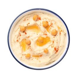Photo of Bowl of tasty hummus with chickpeas and paprika isolated on white, top view
