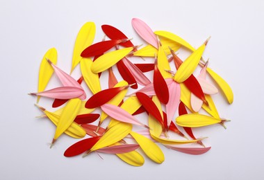 Photo of Pile of beautiful petals on white background, top view