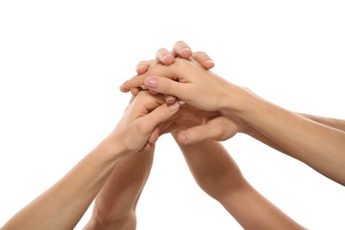 Photo of Young people holding hands together on white background, closeup. Team victory concept