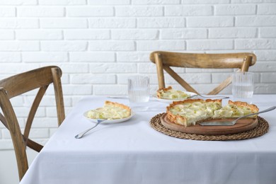 Photo of Tasty leek pie and drink served on table