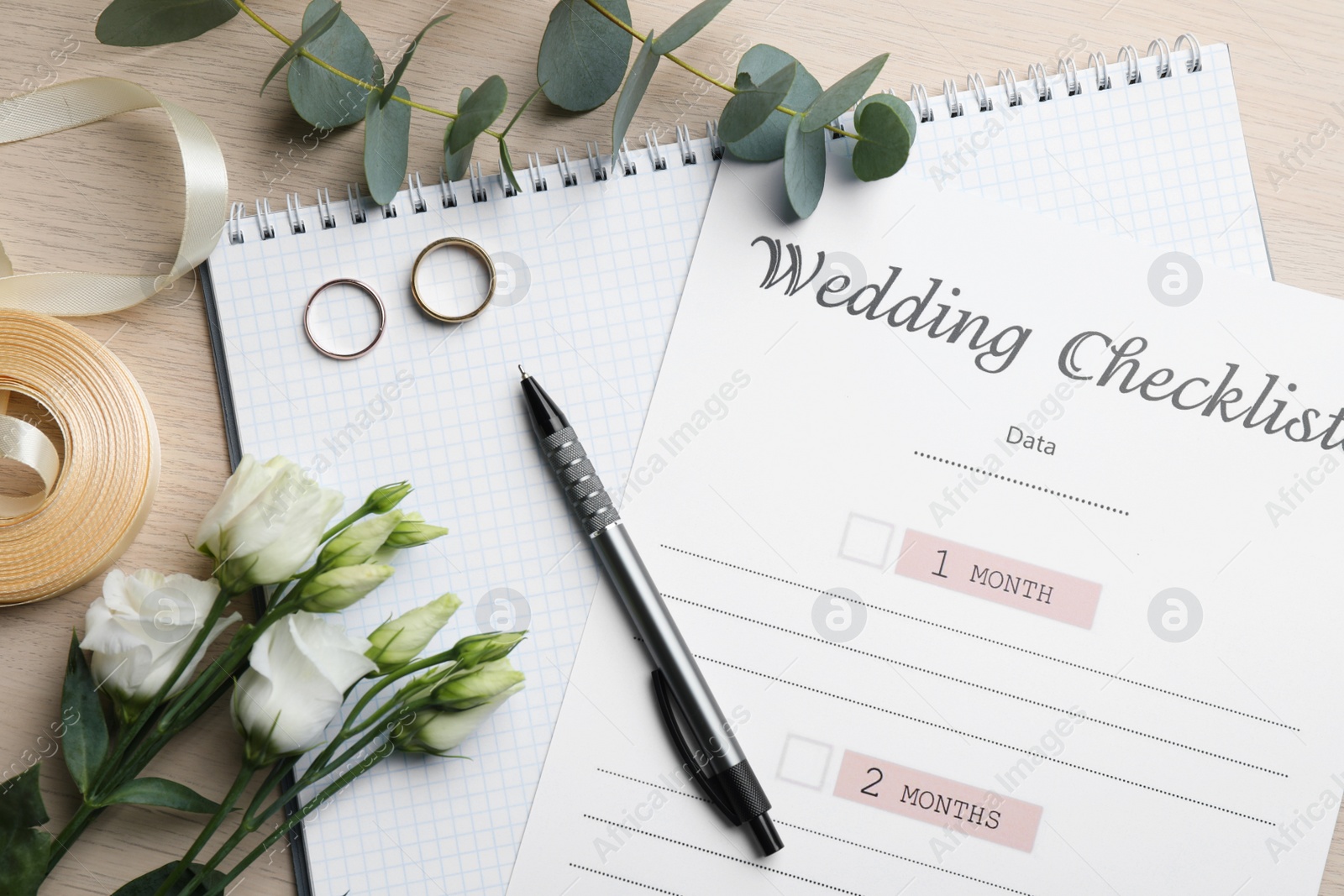 Photo of Flat lay composition with Wedding Checklist on white wooden table