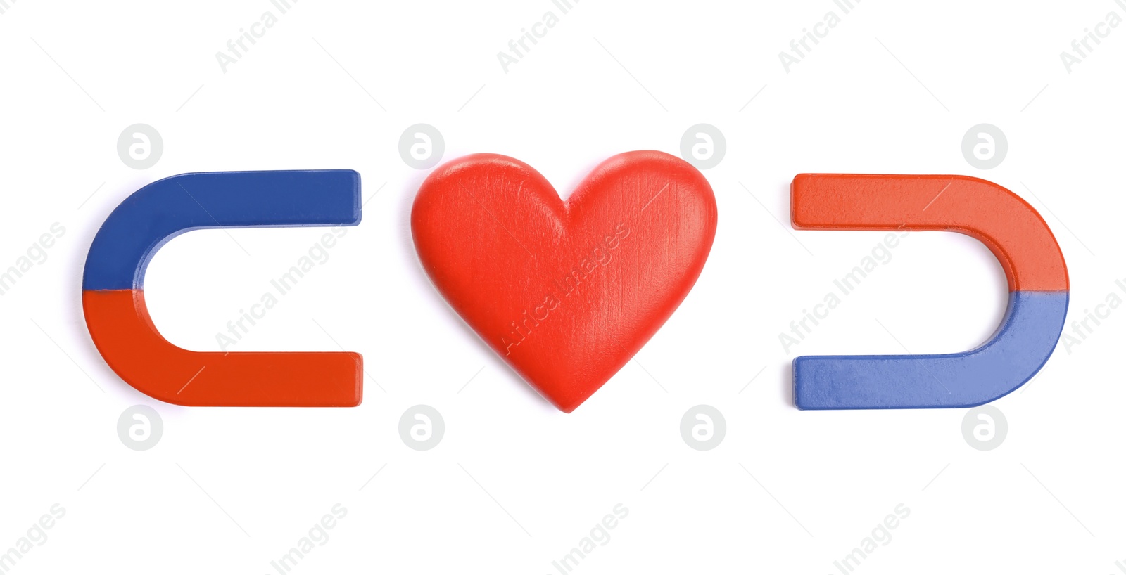 Photo of Red and blue horseshoe magnets with decorative heart on white background, top view