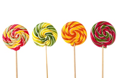 Different tasty colorful candies on white background