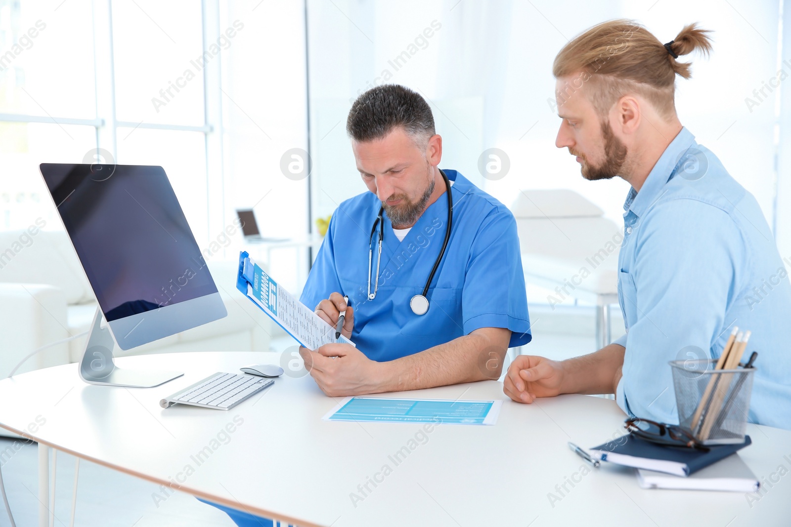 Photo of Man with health problems visiting urologist at hospital