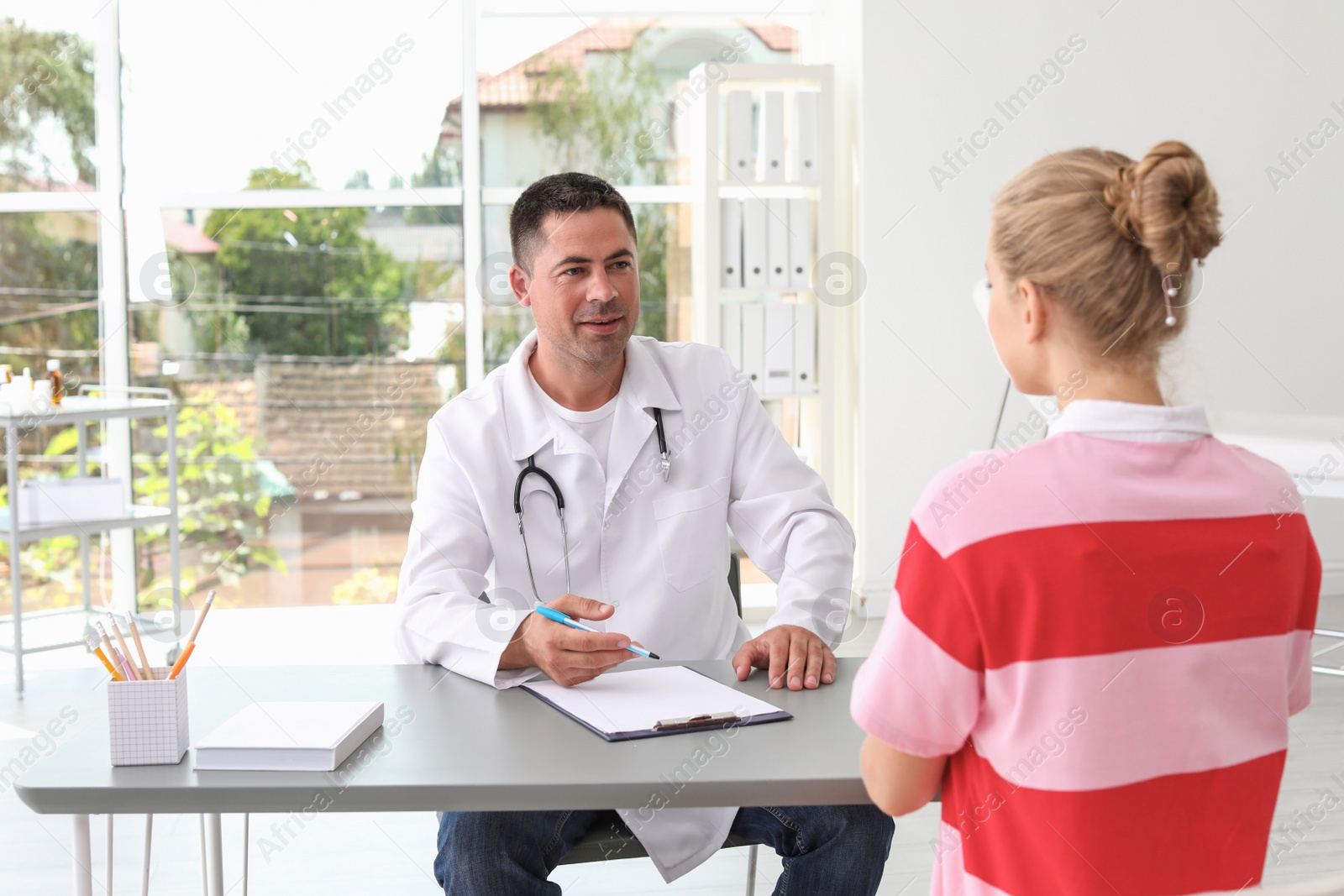 Photo of Patient having appointment with doctor in hospital