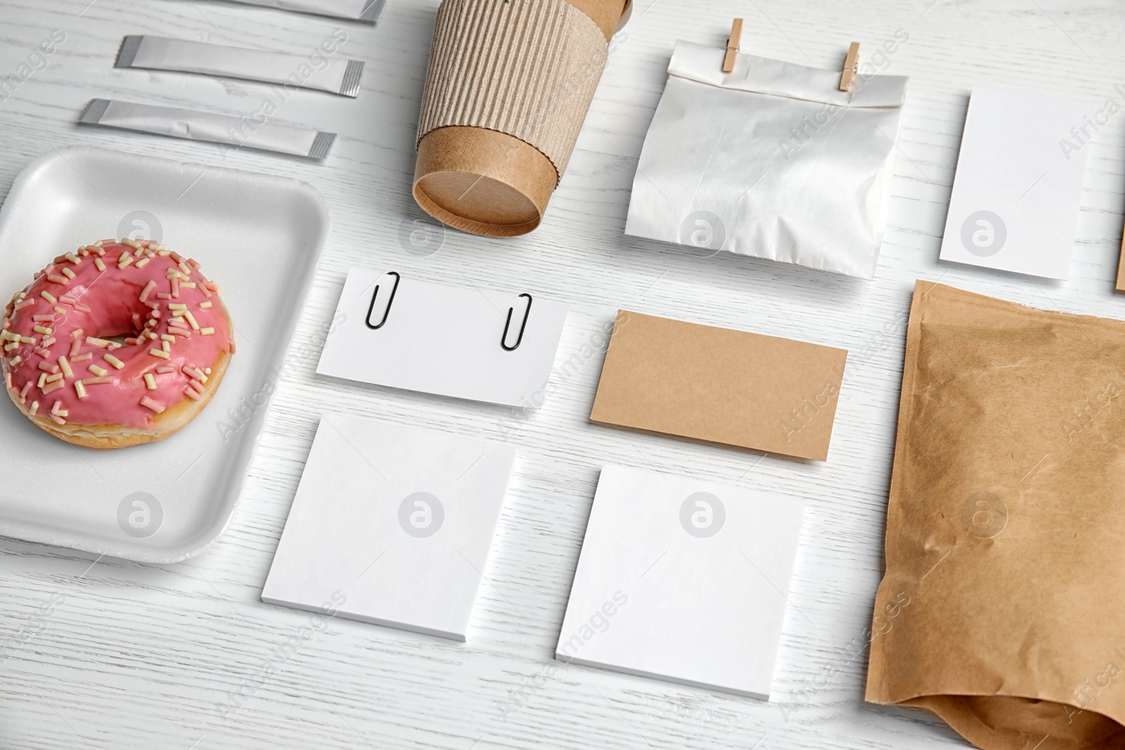 Photo of Composition with items for mock up design on wooden background. Food delivery service