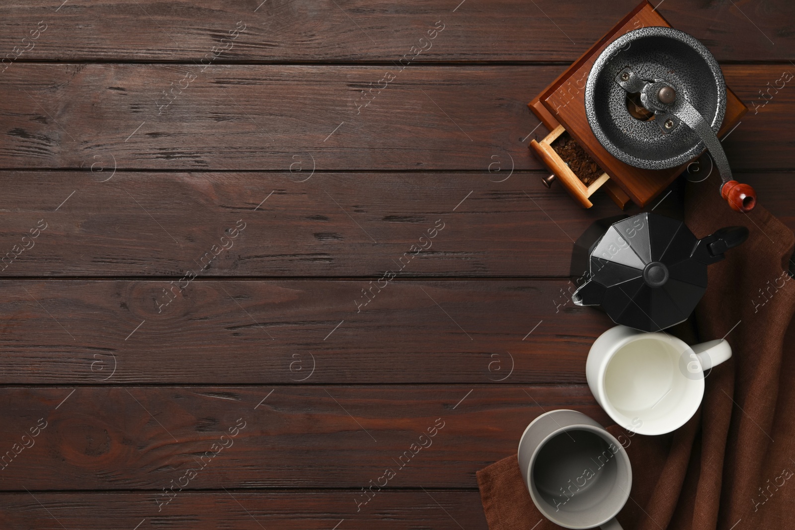 Photo of Set of modern cooking utensils on brown wooden table, flat lay. Space for text