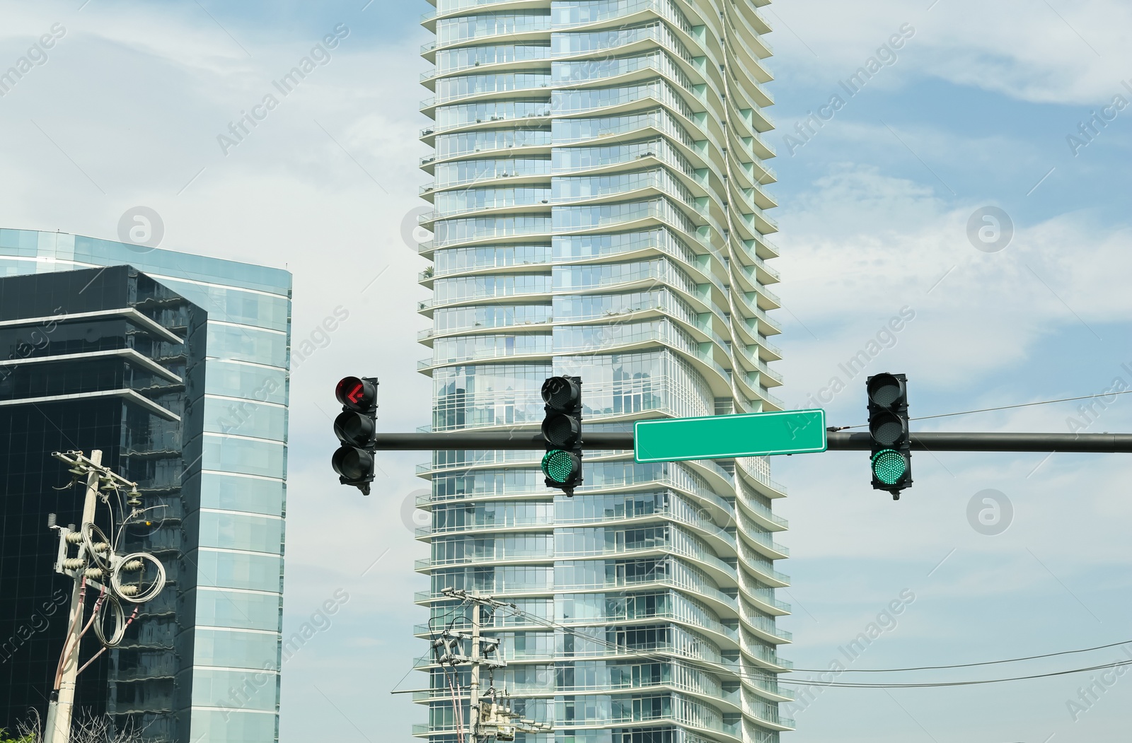 Photo of Overhead traffic lights in city. Road rules