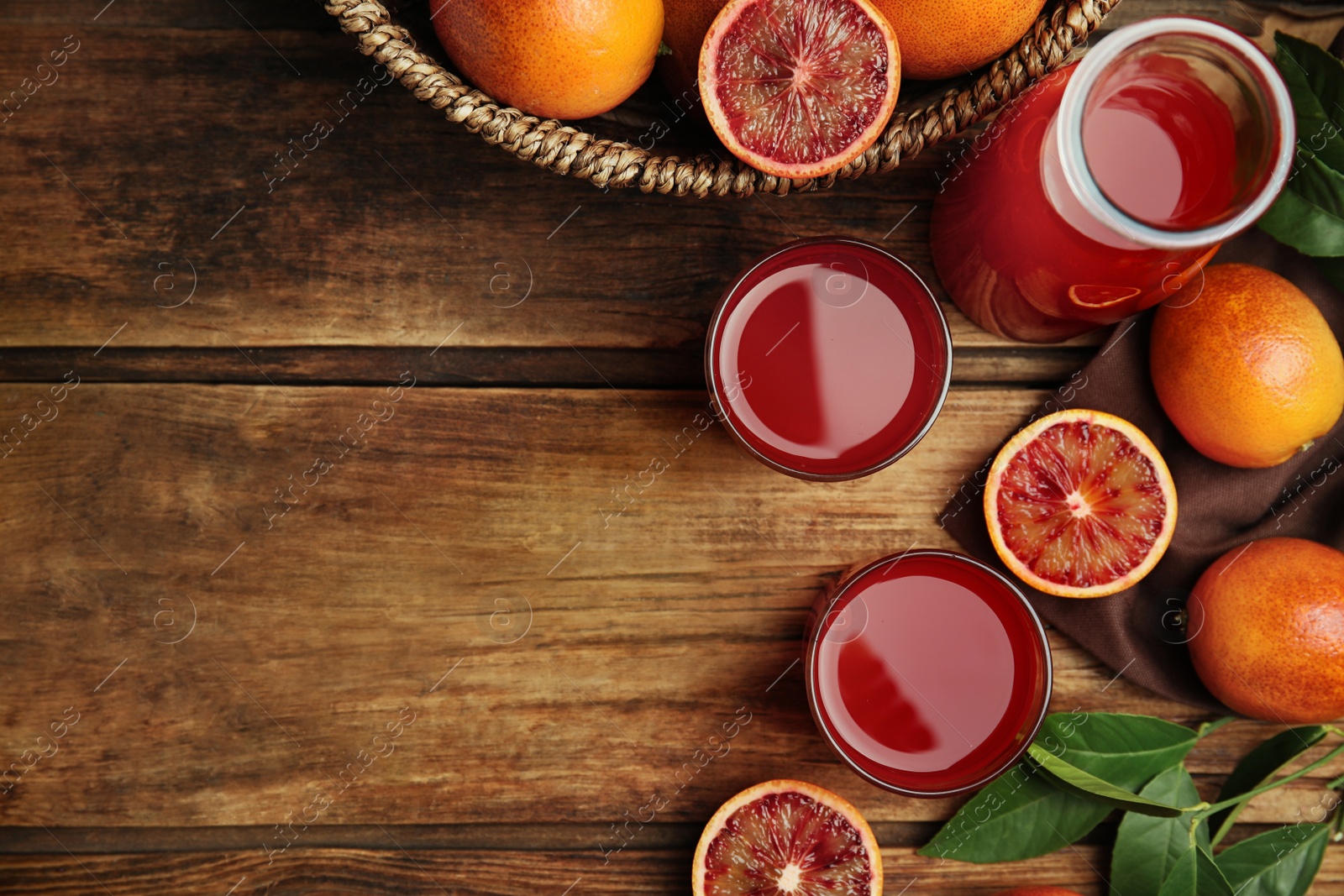 Photo of Tasty sicilian orange juice and fruits on wooden table, flat lay. Space for text