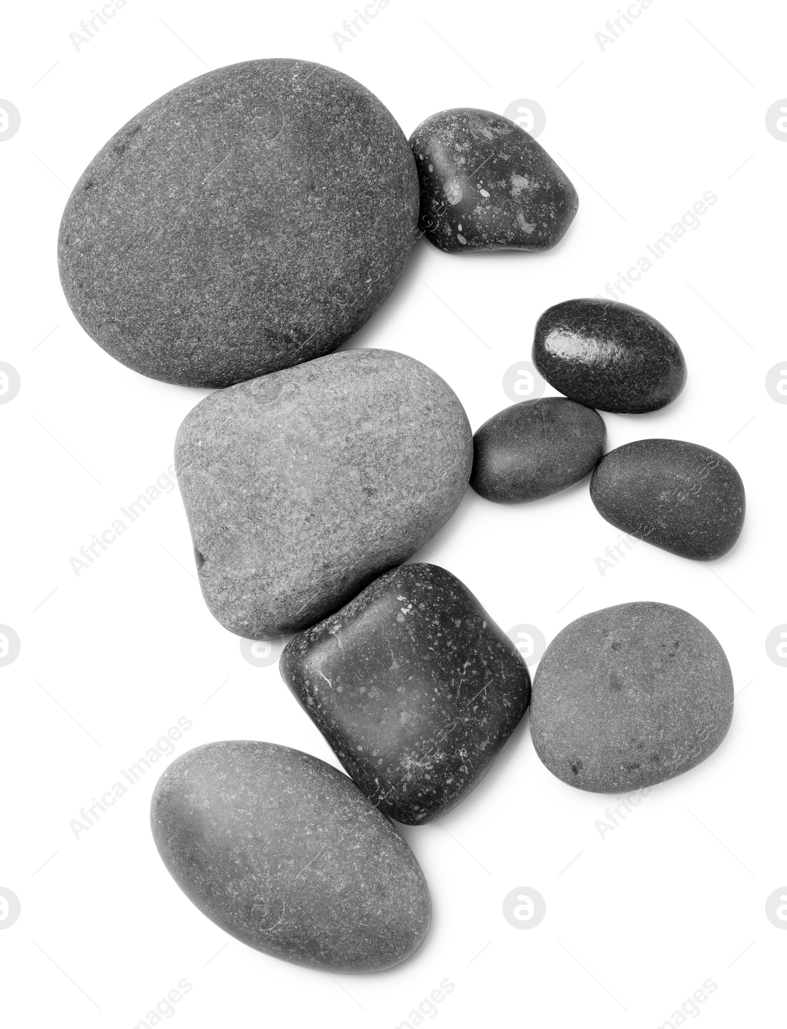 Photo of Group of different stones on white background, top view