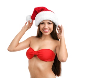 Young beautiful woman in swimsuit and Santa hat on white background. Christmas celebration