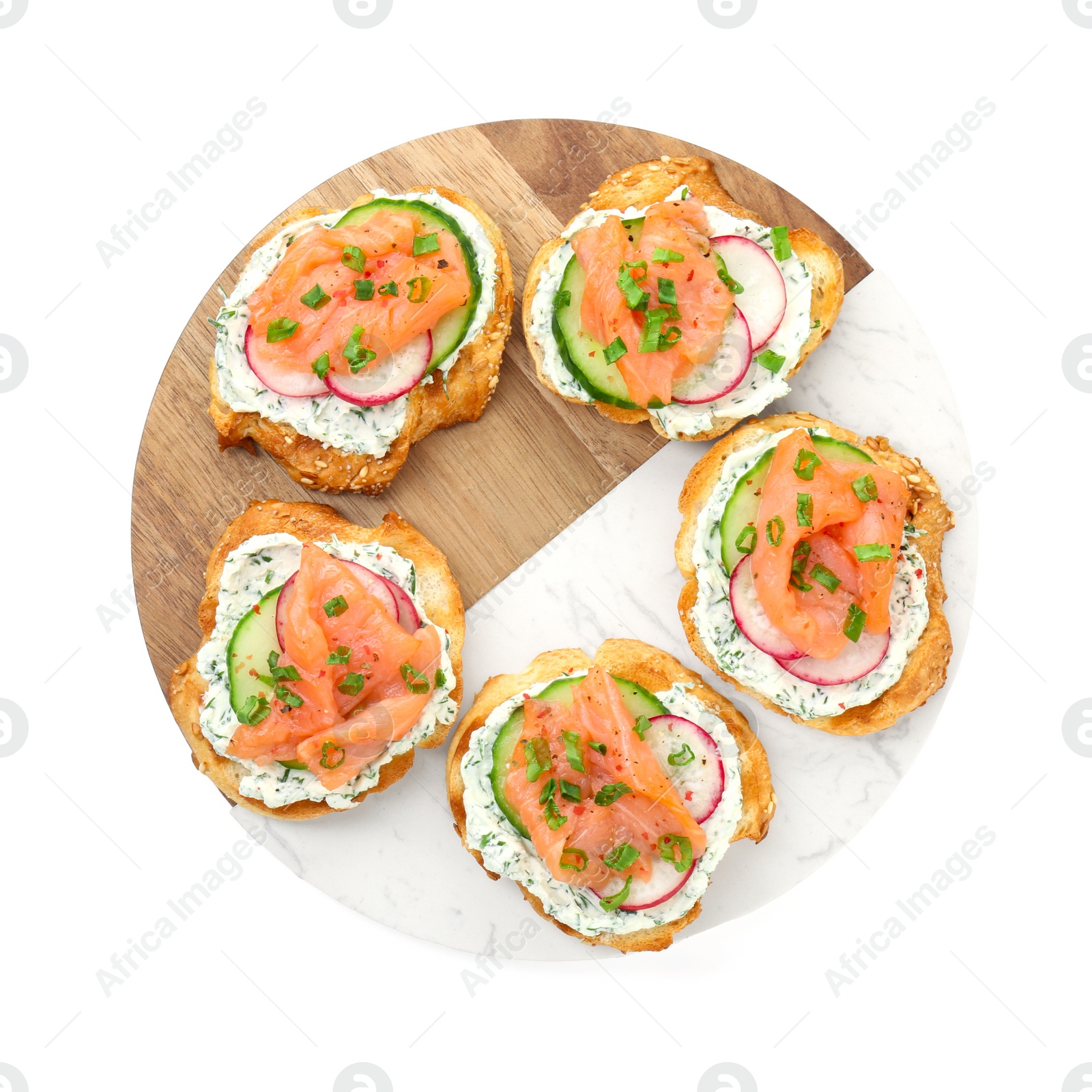 Photo of Tasty canapes with salmon, cucumber, radish and cream cheese isolated on white, top view