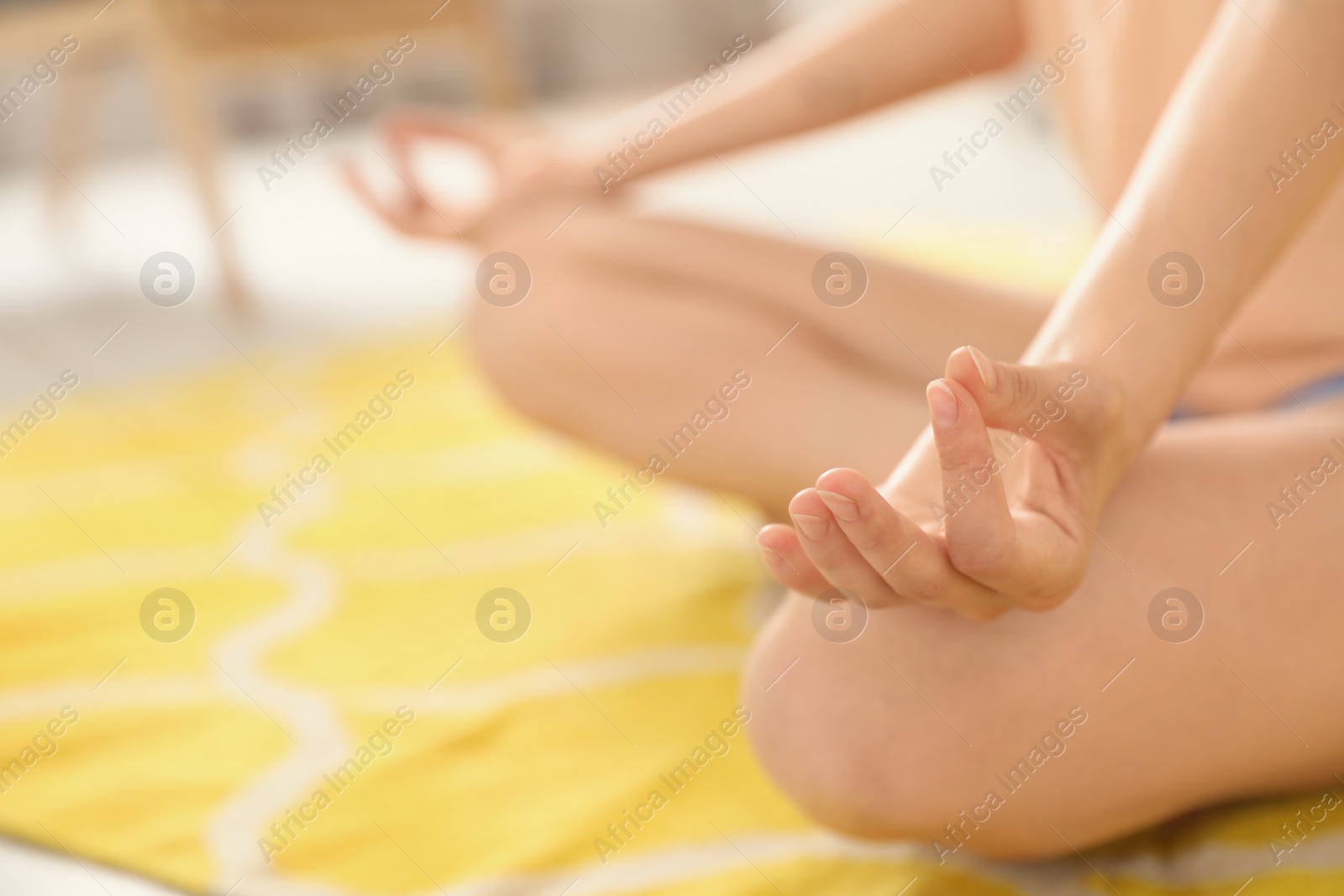 Photo of Young woman practicing zen yoga at home, closeup. Space for text