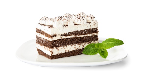 Plate of tiramisu cake with mint isolated on white