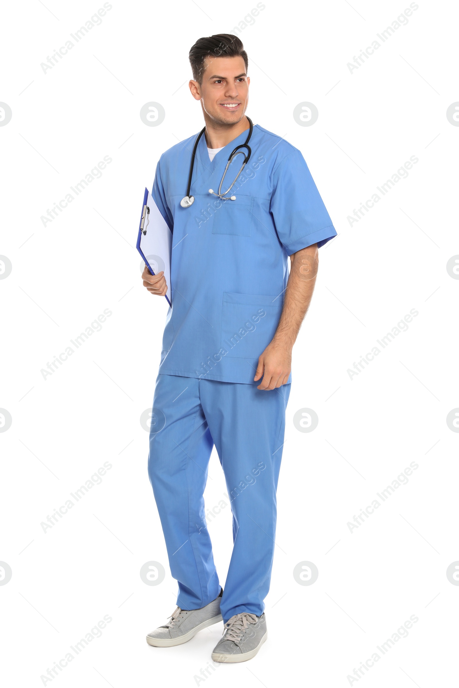 Photo of Full length portrait of medical doctor with clipboard and stethoscope isolated on white