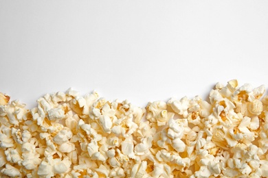 Photo of Delicious fresh popcorn on white background, top view