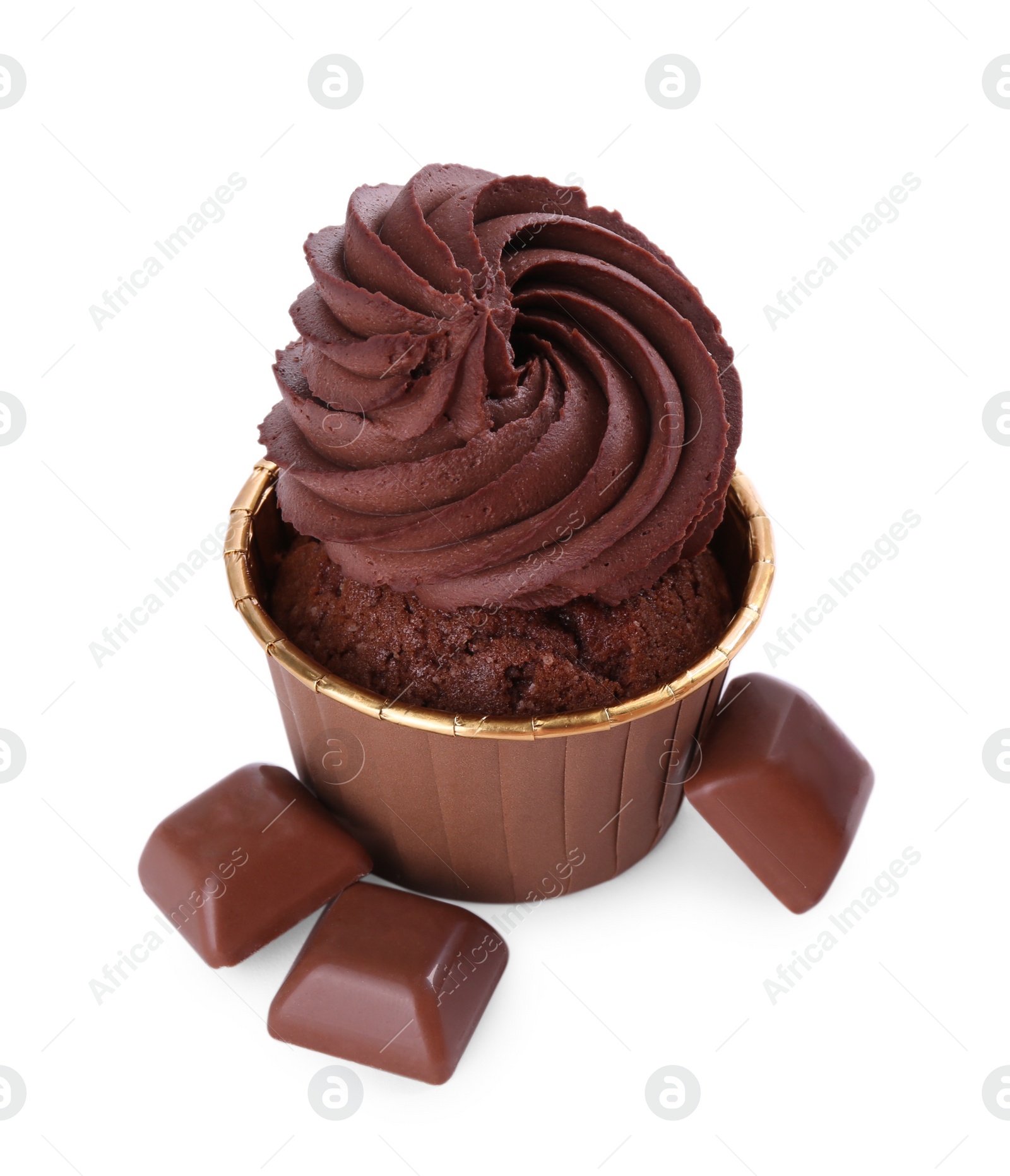 Photo of One delicious cupcake and chocolate pieces isolated on white