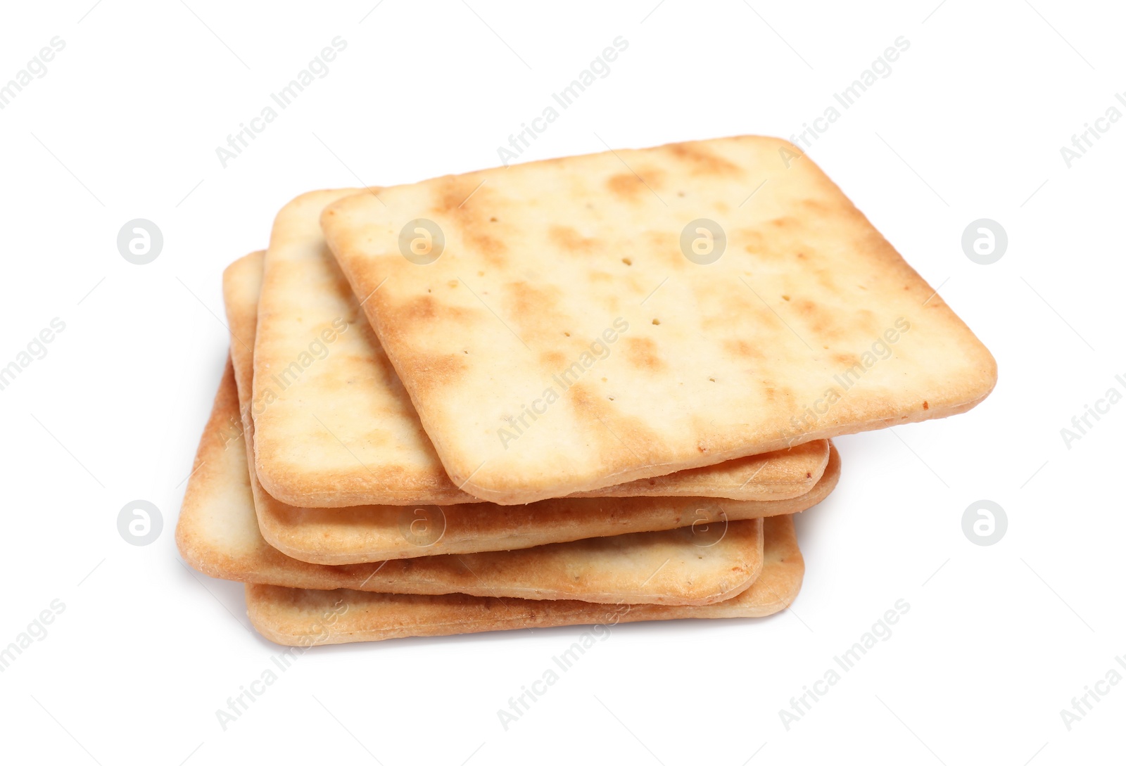 Photo of Tasty crispy square crackers isolated on white