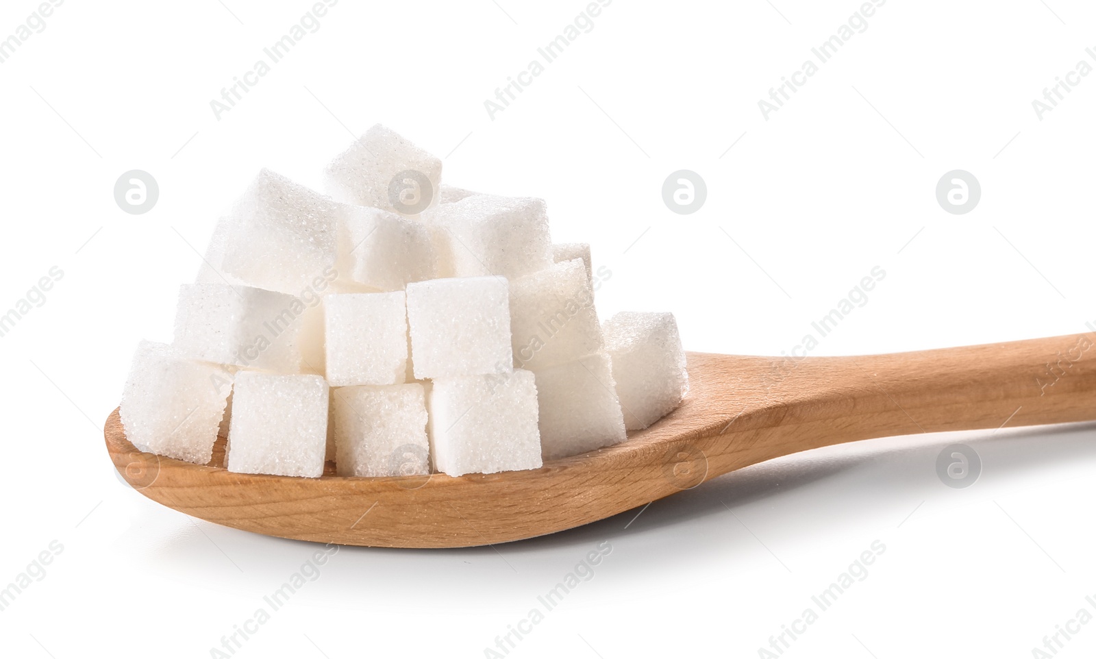 Photo of Refined sugar cubes in wooden spoon on white background