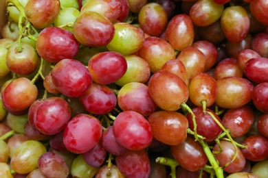 Fresh ripe juicy grapes as background, closeup view