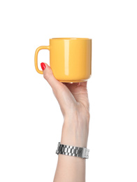 Woman holding yellow cup on white background, closeup