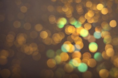 Blurred view of shiny lights on grey background. Bokeh effect