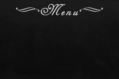 Image of Black chalkboard with word Menu as background. Mockup for design