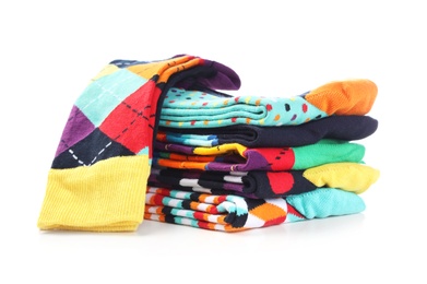 Photo of Many new colorful socks on white background