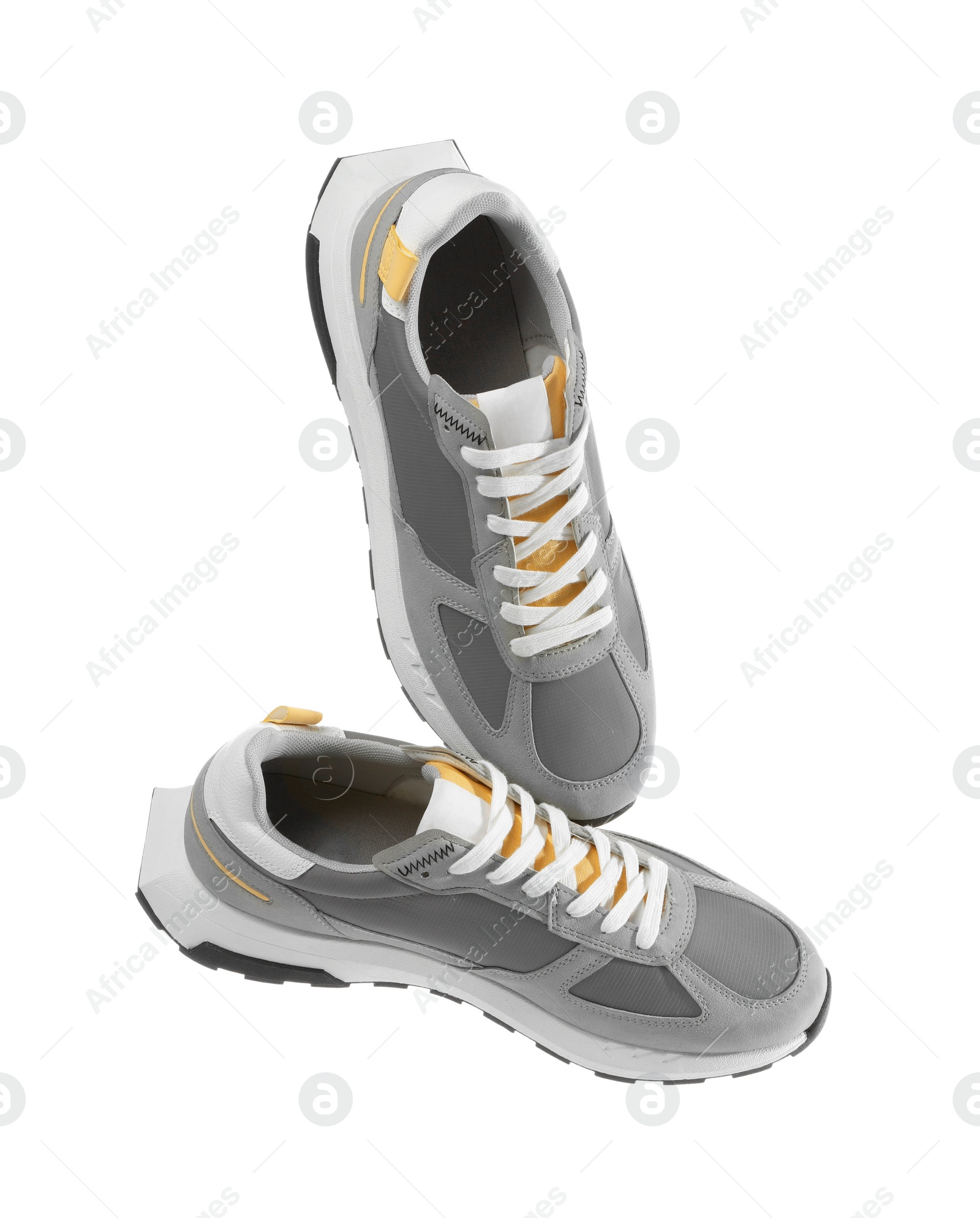 Photo of Pair of stylish grey sneakers isolated on white