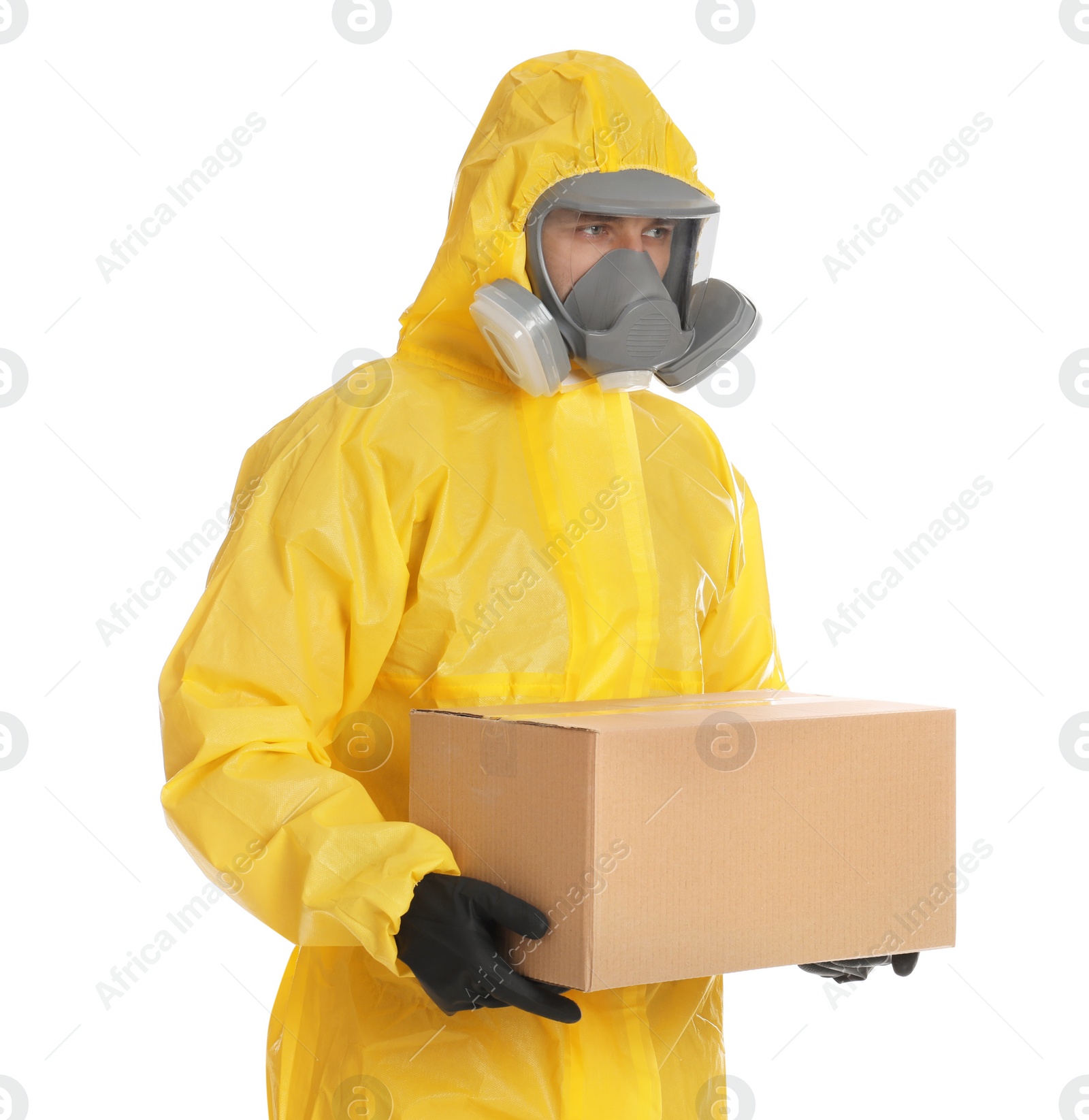 Photo of Man wearing chemical protective suit with cardboard box on white background. Prevention of virus spread