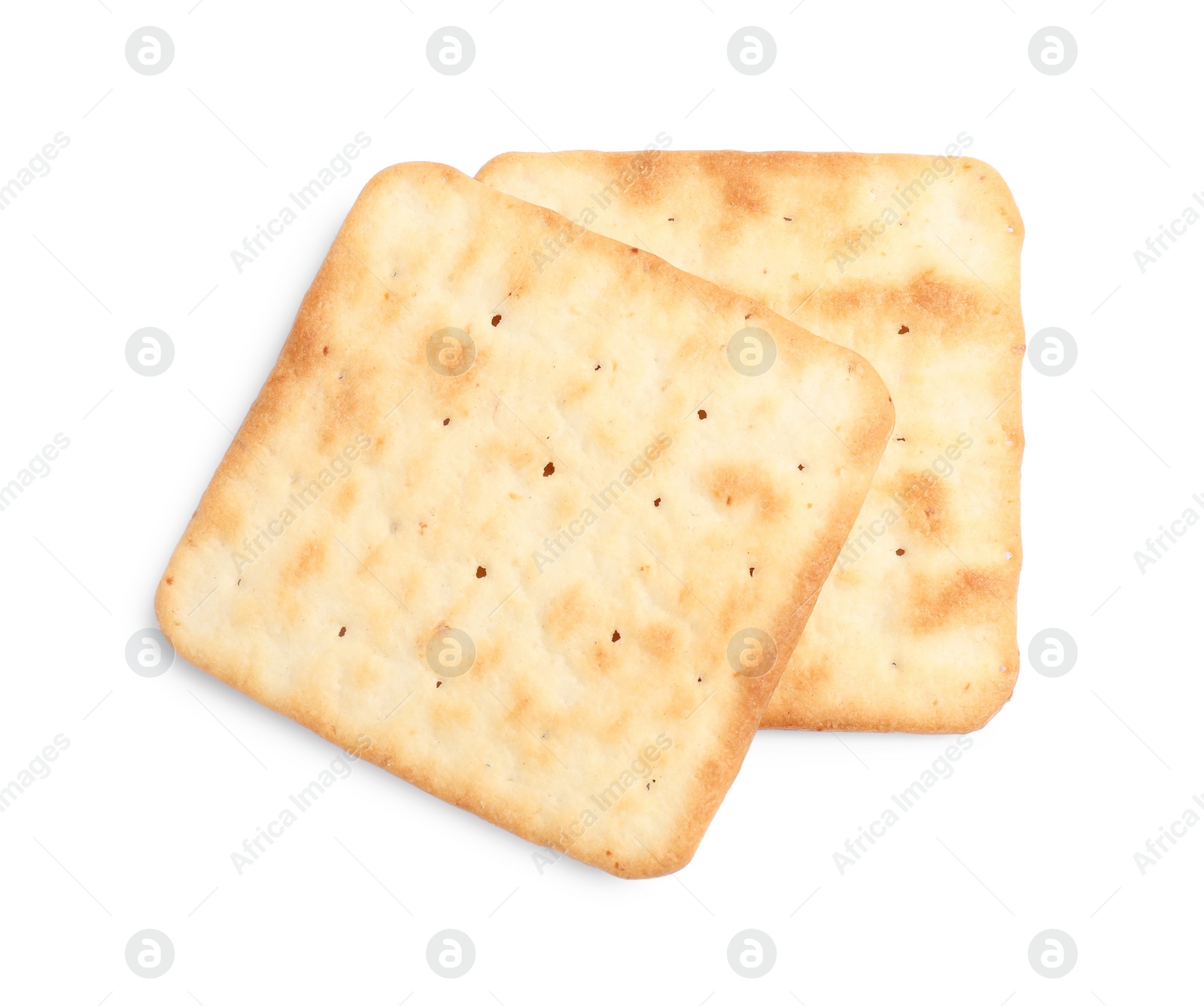 Photo of Tasty crispy square crackers isolated on white, top view