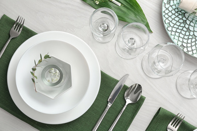 Photo of Elegant festive setting on white wooden table, flat lay