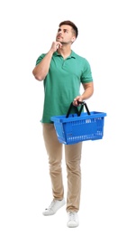 Photo of Young man with empty shopping basket isolated on white