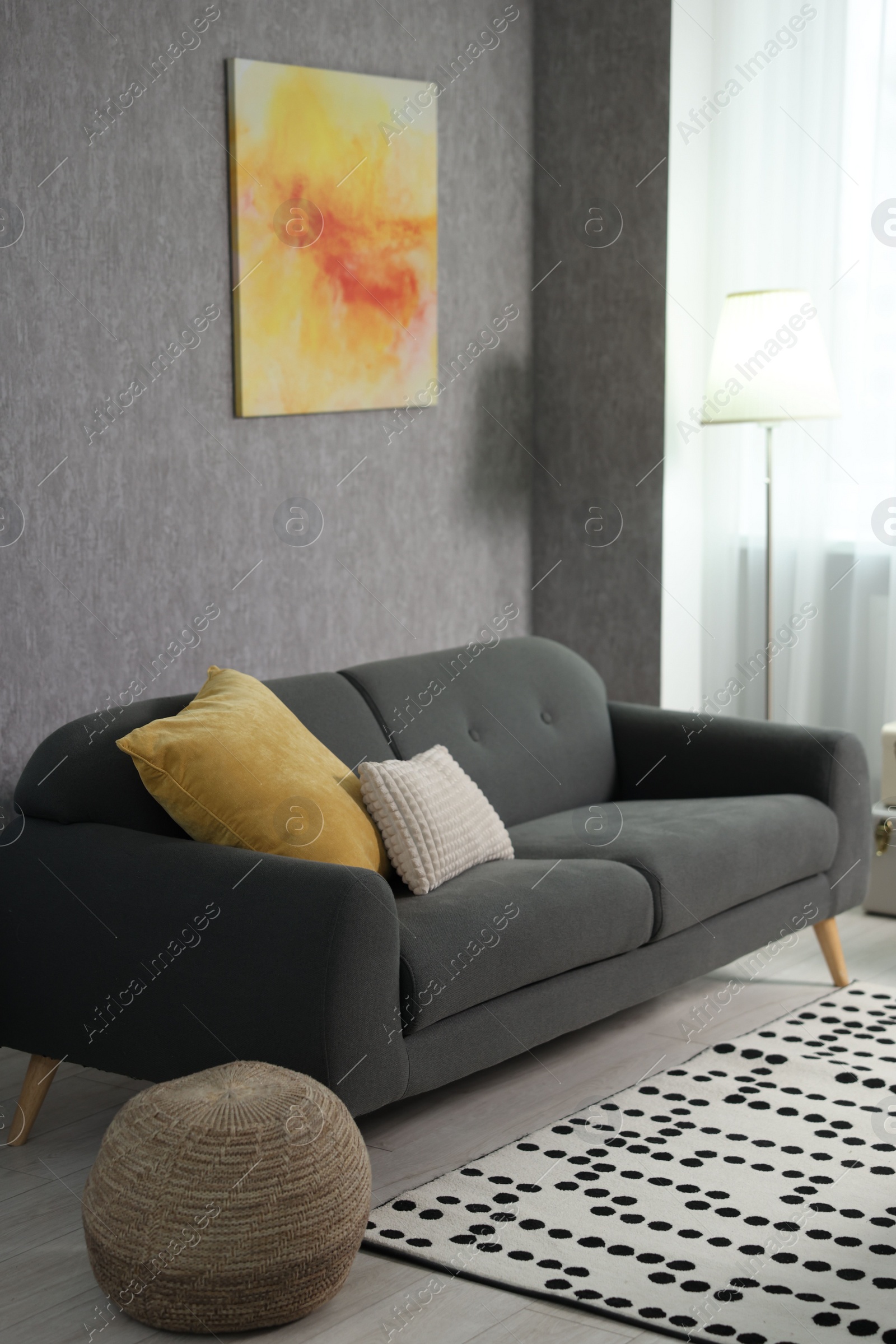 Photo of Home renovation. Room interior with stylish gray wallpaper on wall