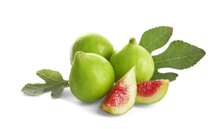 Photo of Whole and cut green figs on white background