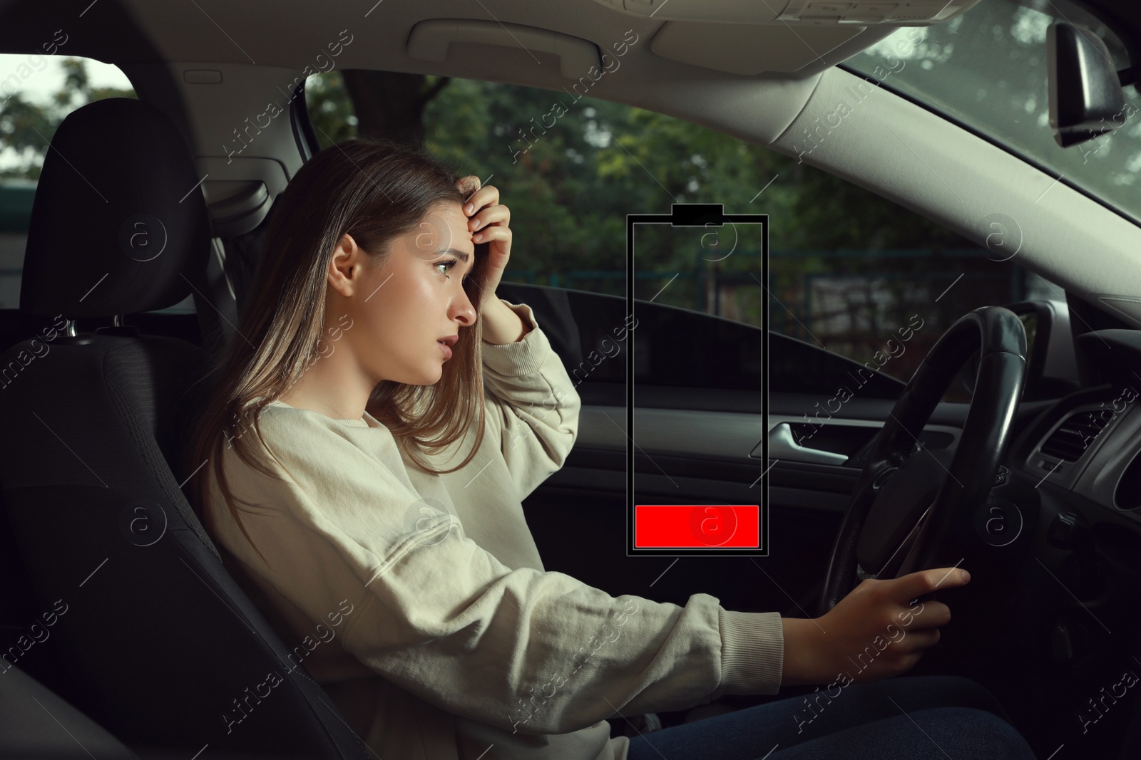 Image of Illustration of discharged battery and tired woman in car. Extreme fatigue