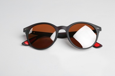 Stylish sunglasses on white background. Fashionable accessory