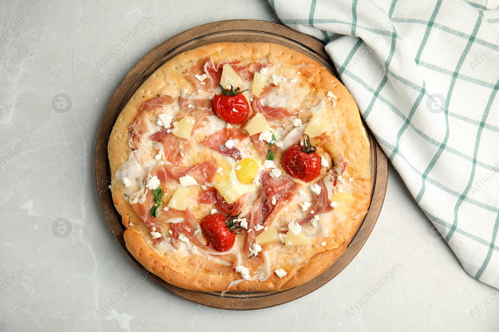 Photo of Delicious homemade pita pizza on light marble table, top view