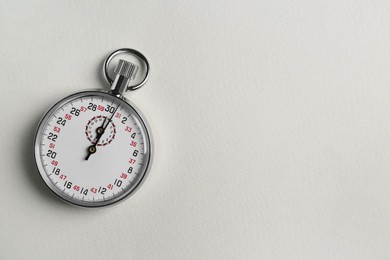 Vintage timer on light grey background, top view. Space for text