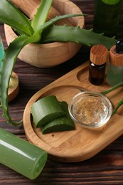 Homemade aloe gel and fresh ingredients on wooden table