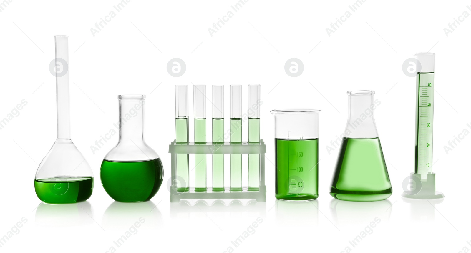 Image of Laboratory glassware with green liquid isolated on white