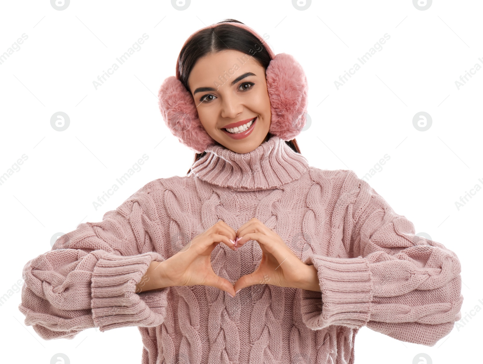 Photo of Beautiful young woman wearing earmuffs on white background