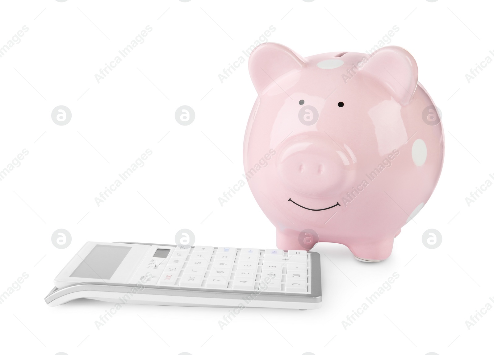 Photo of Calculator and pink piggy bank isolated on white